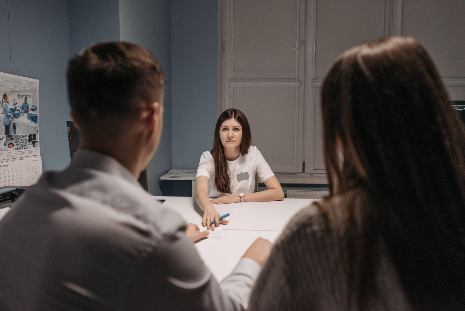 Clinic staff meeting around a table